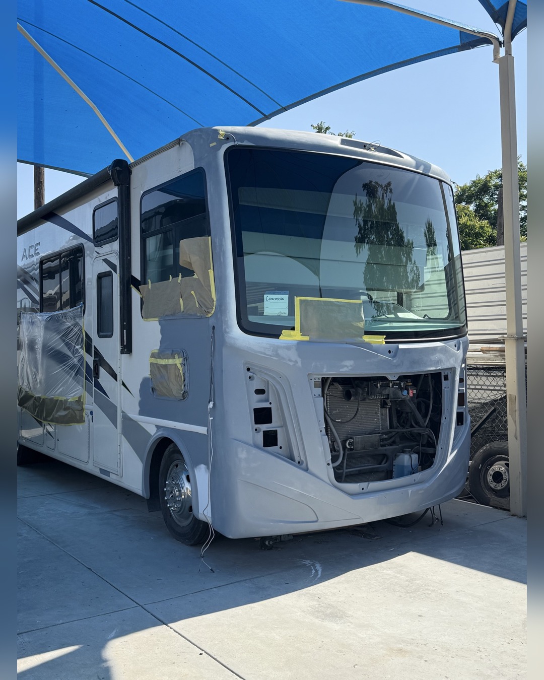 Damaged ACE motorhome front end before repair, first view