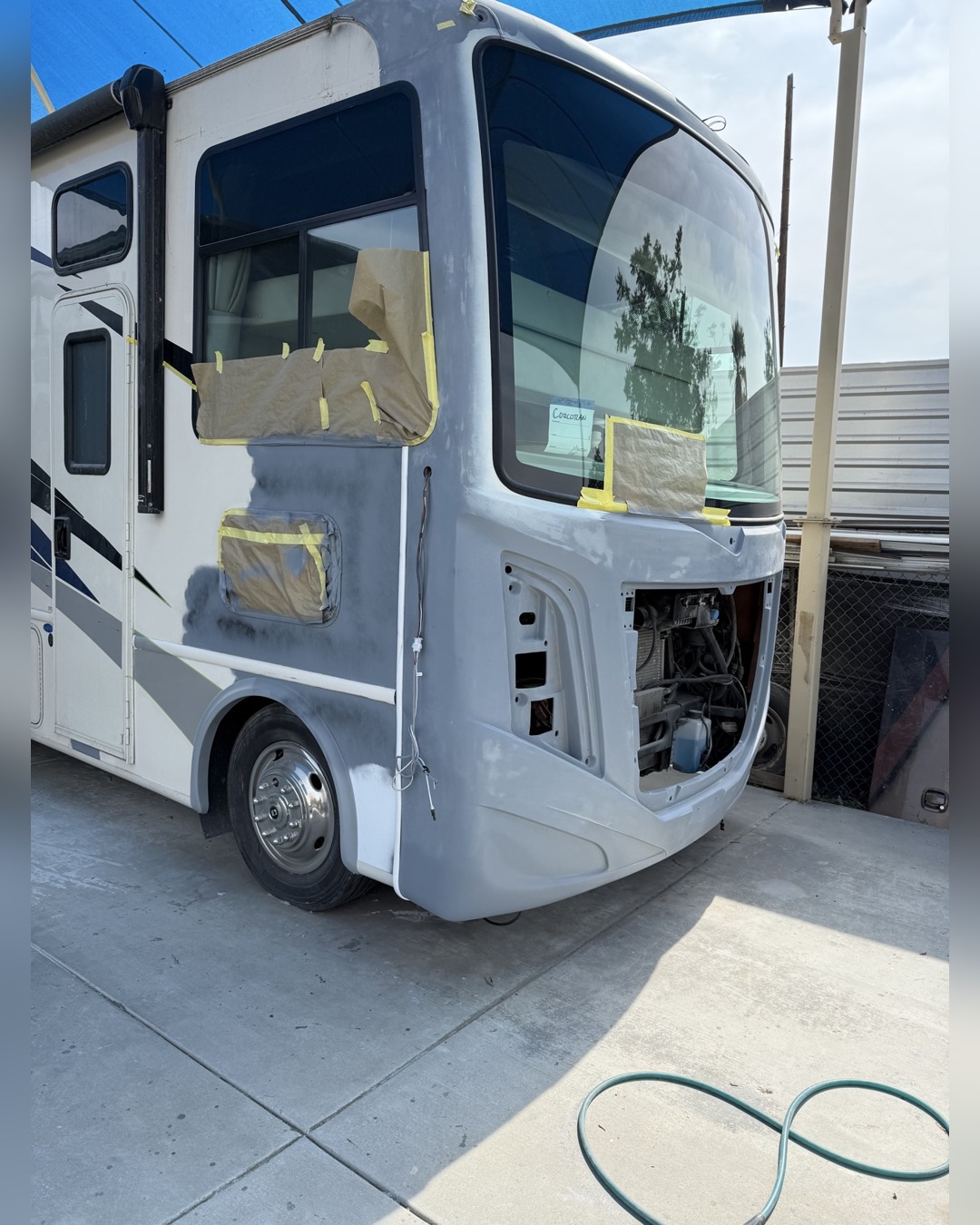 Damaged ACE motorhome front end before repair, second view