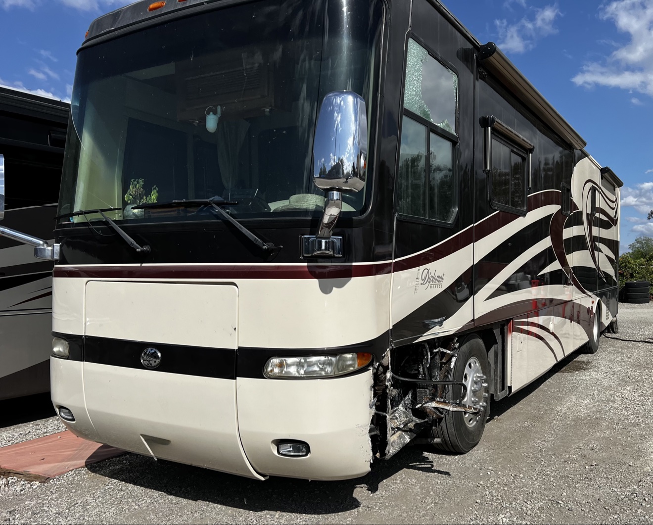 Monaco Diplomat with front damage caused by a tire blowout