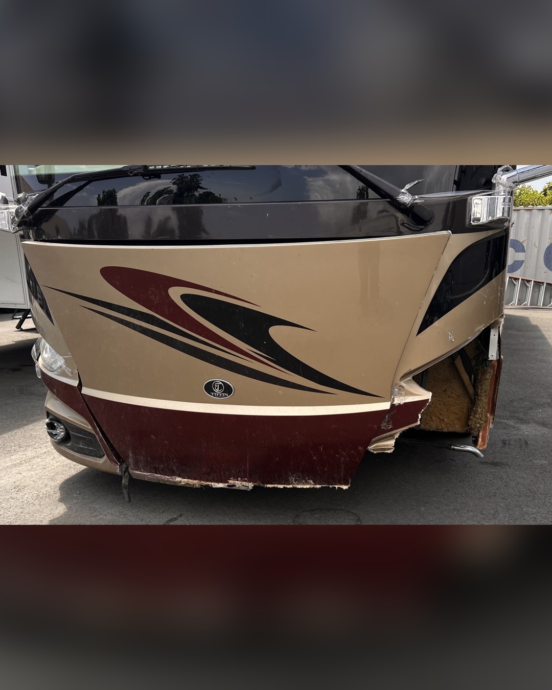 Tiffin motorhome with severe front cap collision damage